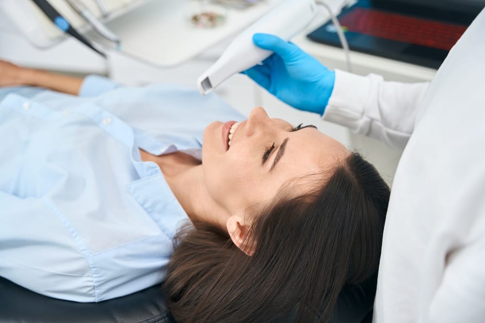 Intraoral Scanning in Progress – Dentist in San Mateo Dentist using an intraoral scanner on a smiling patient to capture detailed dental images — Dentist in San Mateo